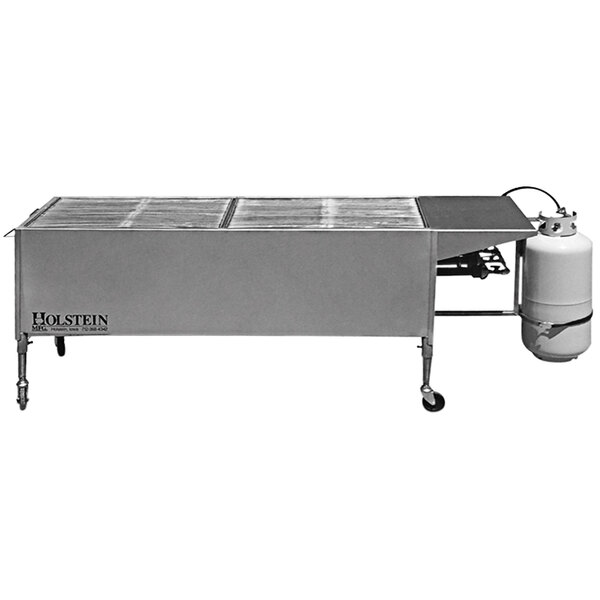 A Holstein Manufacturing stainless steel propane grill on a metal table with a gas cylinder.