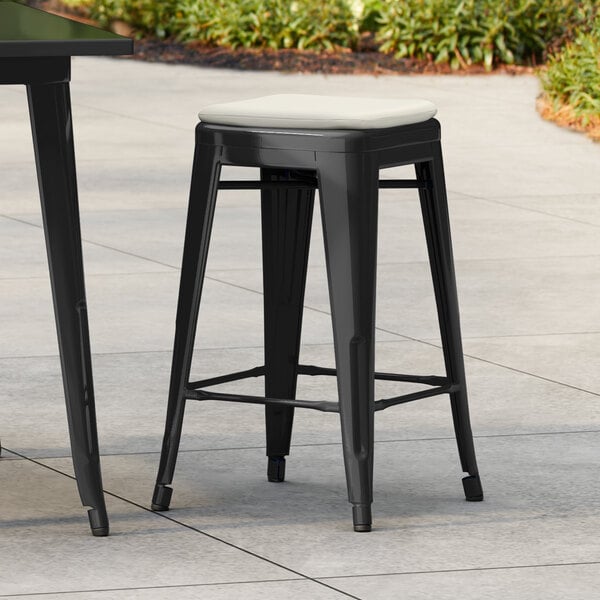 Lancaster Table & Seating Alloy Series Black Outdoor Backless Counter Height Stool with Tan Fabric Magnetic Cushion
