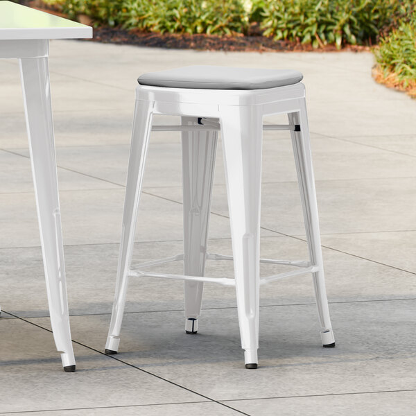 Lancaster Table & Seating Alloy Series White Outdoor Backless Counter Height Stool with Gray Fabric Magnetic Cushion