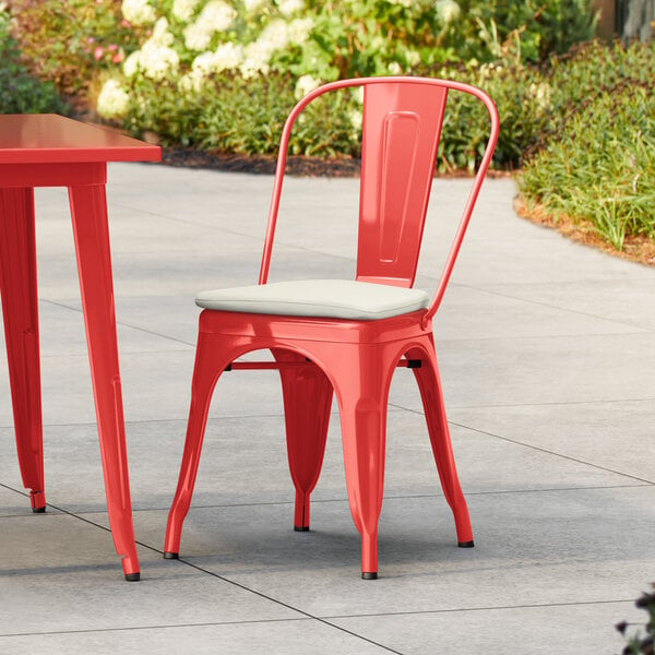 Lancaster Table & Seating Alloy Series Ruby Red Outdoor Cafe Chair with Tan Fabric Magnetic Cushion