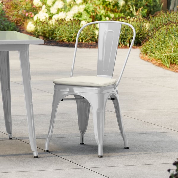Lancaster Table & Seating Alloy Series Silver Outdoor Cafe Chair with Tan Fabric Magnetic Cushion