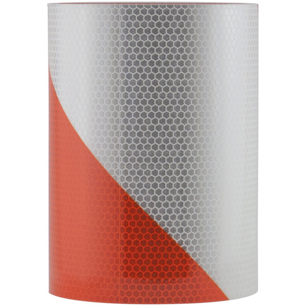 A red and white canister of Cortina Hi-Intensity Prismatic Barricade Tape with red and white stripes on a white surface.