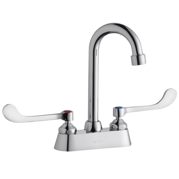 A silver Elkay deck-mount faucet with 6" wristblade handles and a gooseneck swing spout.