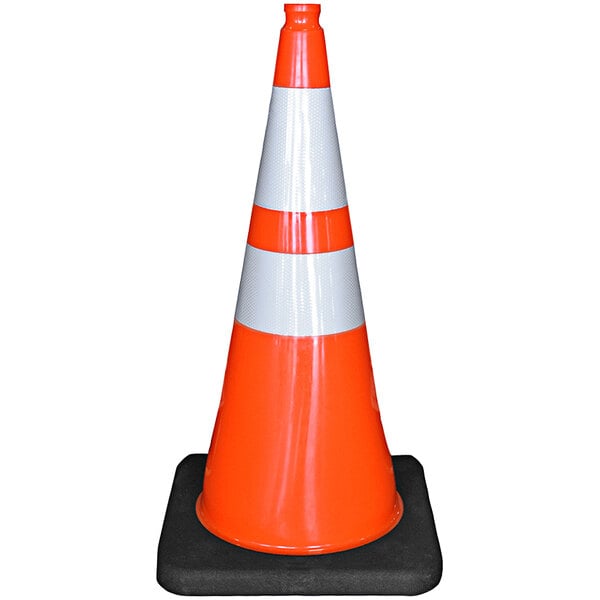 A close-up of a Cortina orange traffic cone with a black base.