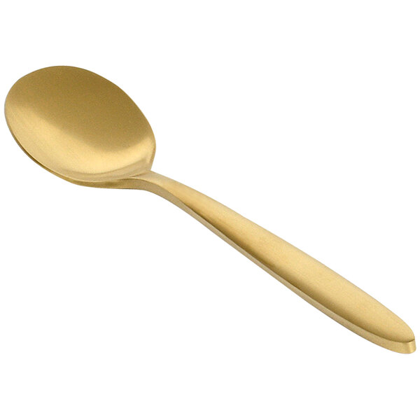 A matte brass Front of the House Luca teaspoon with a handle on a white background.