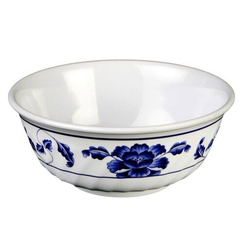 A white melamine bowl with blue lotus flowers and swirls.