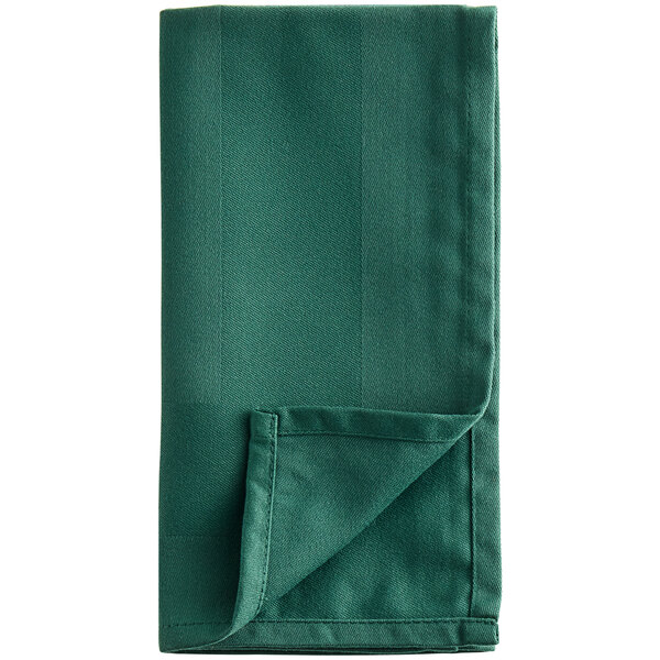 A folded Oxford forest green cloth napkin.