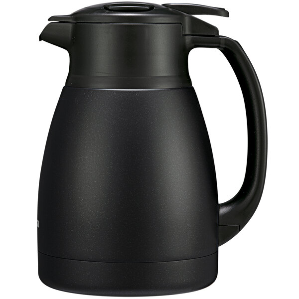 A Zojirushi matte black stainless steel coffee carafe with a handle.