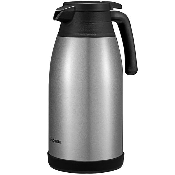 A silver thermos with black handle.