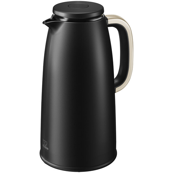 A black Zojirushi coffee carafe with a handle and push-button stopper.