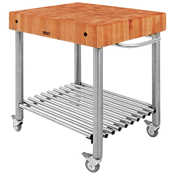 A John Boos cherry kitchen cart with a wooden cutting board on a metal frame.