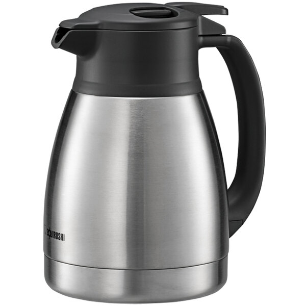 A silver stainless steel Zojirushi coffee carafe with a black handle.