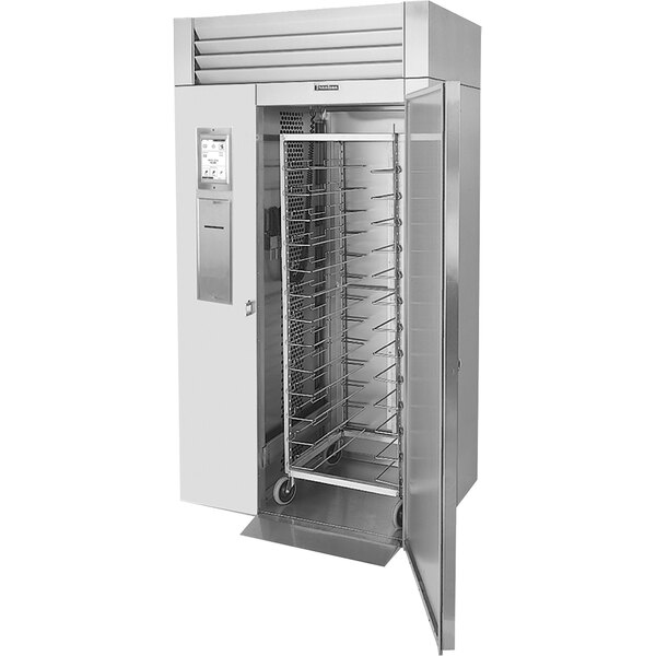 A Traulsen metal cabinet with racks inside.