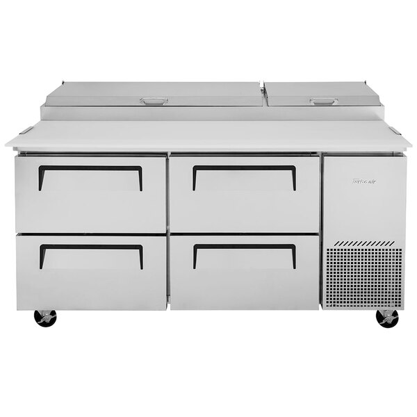 A white Turbo Air pizza prep refrigerator with four drawers and black handles.