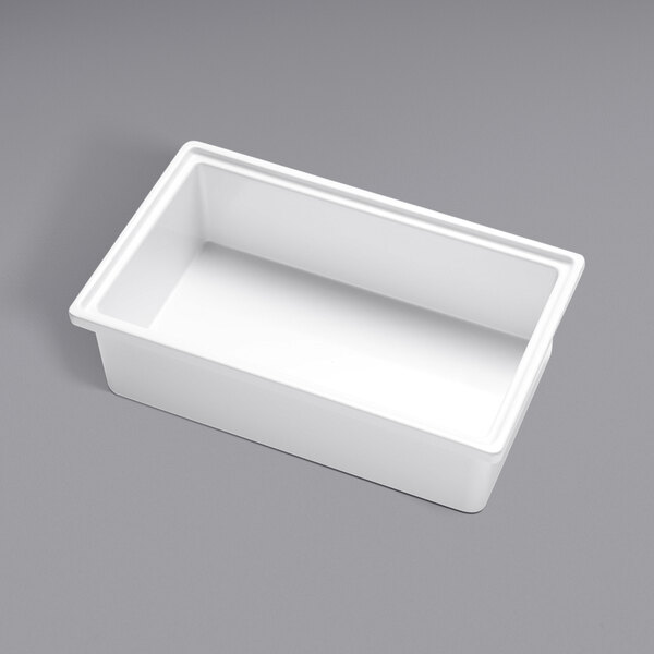 A white rectangular container on a gray surface.