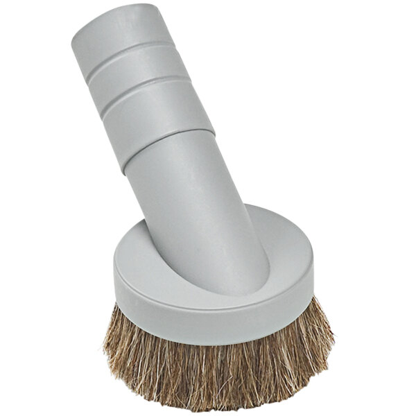 A white circular dust brush tool with a white handle.