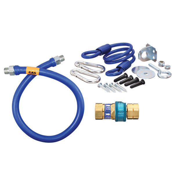 A blue Dormont gas connector kit with a restraining cable and hose parts.