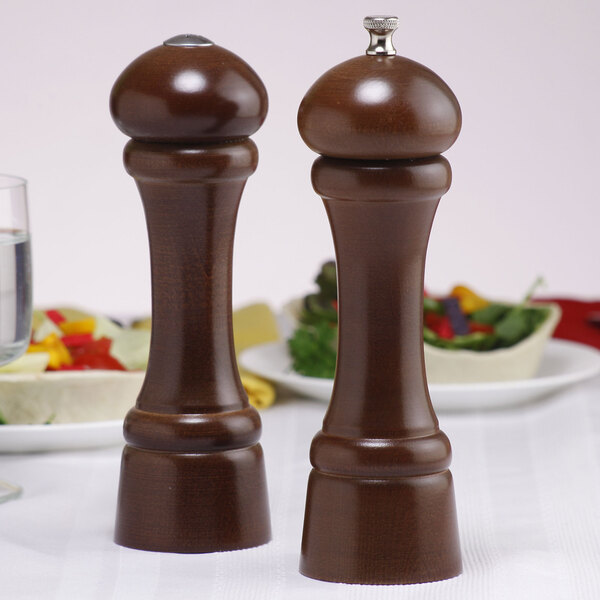 A wooden salt and pepper shaker set on a table.