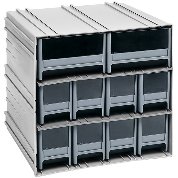 A stack of grey rectangular Quantum storage bins with windows on white background.