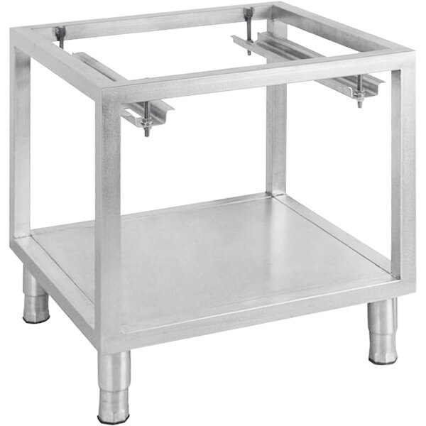 A stainless steel Mibrasa oven stand with two shelves on a metal table.