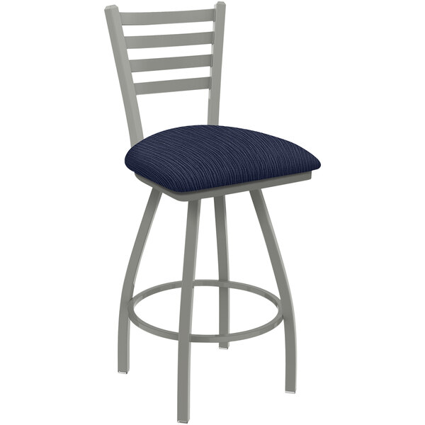 A Holland Bar Stool ladderback counter stool with a blue padded seat and back.