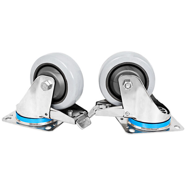 A set of 4 Mibrasa stainless steel casters with rubber wheels and metal supports. Two white and blue wheels and two white bases.