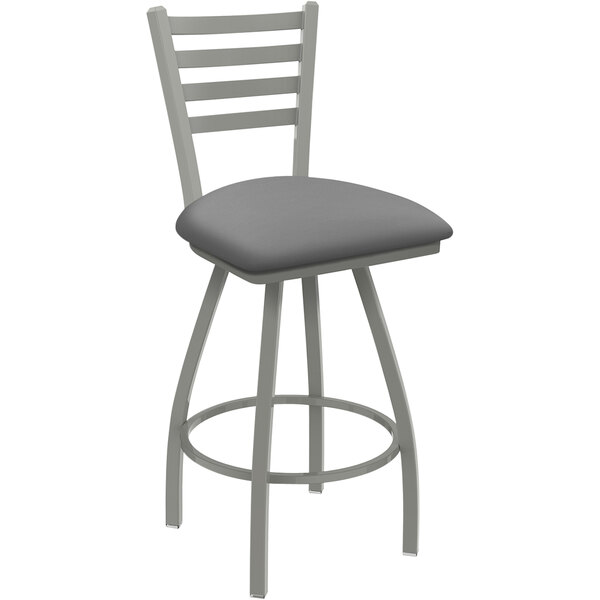 A grey Holland Bar Stool ladderback swivel counter stool with a grey padded seat.