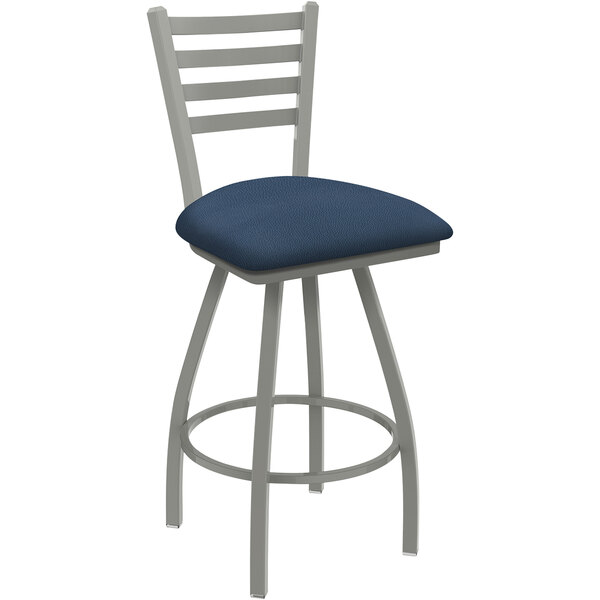A Holland Bar Stool Jackie ladderback swivel counter stool with a blue cushion and white base.