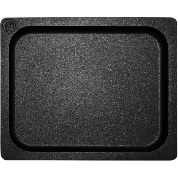 A black rectangular Mibrasa cast aluminum roasting tray with handles.
