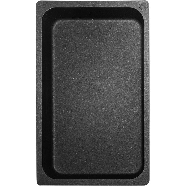 A black rectangular Mibrasa cast aluminum roasting tray.