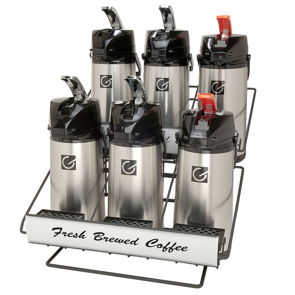 A Grindmaster airpot rack holding six coffee containers.