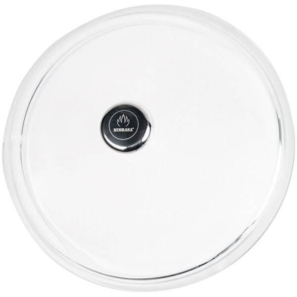 A clear glass lid with a silver circle in the middle.