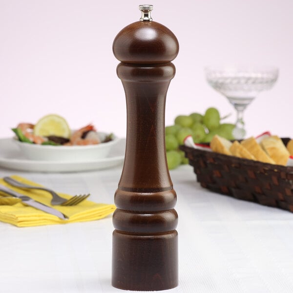 A Chef Specialties Imperial Walnut pepper mill on a table.