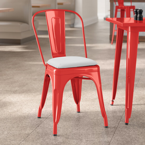Lancaster Table & Seating Alloy Series Ruby Red Indoor Cafe Chair with White Vinyl Cushion