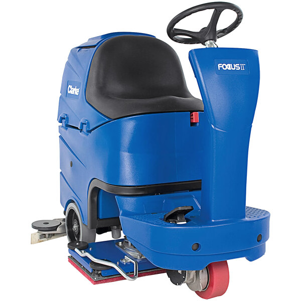 A blue Clarke Focus II BOOST28 MicroRider floor scrubber with wheels and a black seat.