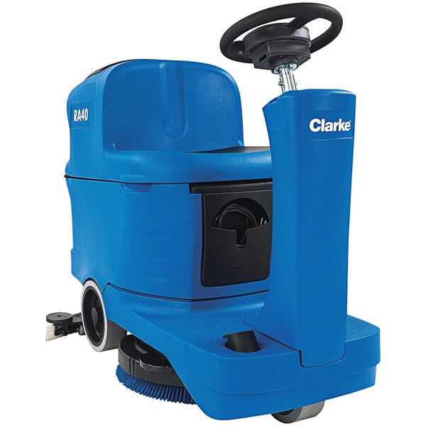 A blue and black Clarke floor scrubber with wheels.