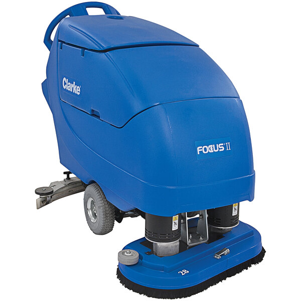 A blue Clarke Focus II walk behind floor scrubber machine with wheels.