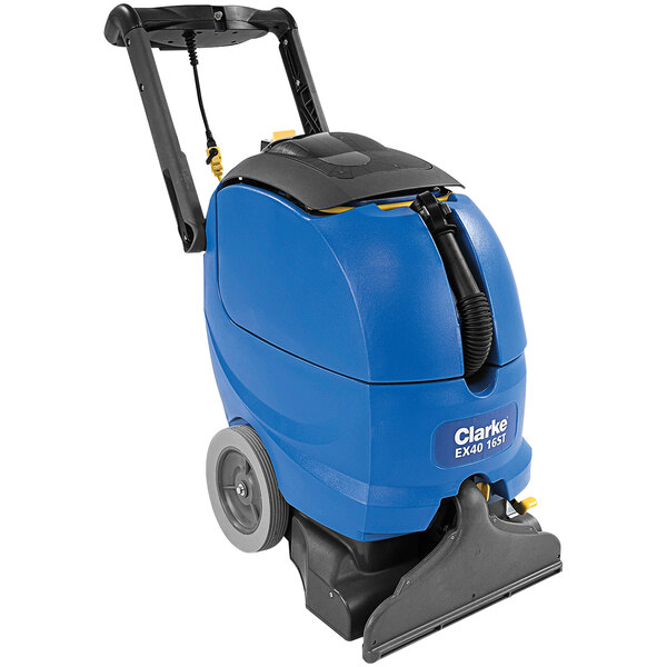 A blue and black Clarke carpet extractor with wheels.