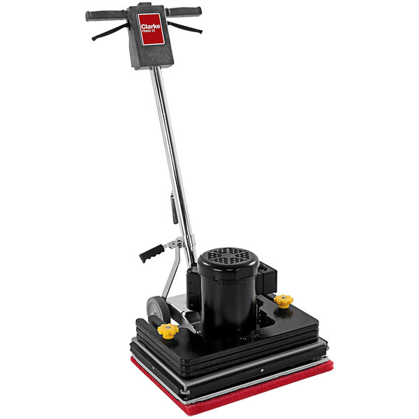 A Clarke floor scrubber with a red handle and black wheels.