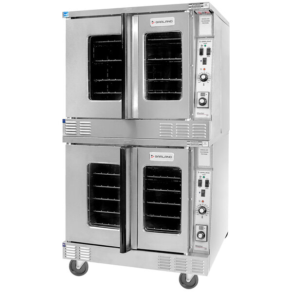 A large stainless steel Garland commercial convection oven with wheels.