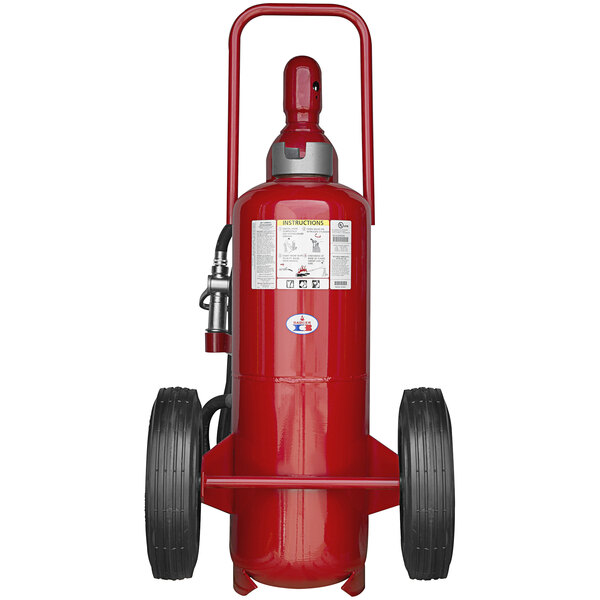 A Badger red fire extinguisher with black wheels.