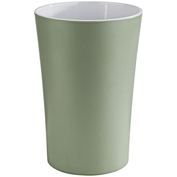 A green melamine cup with a white lid.