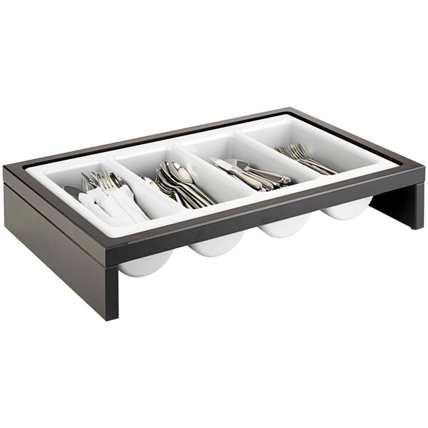 A wood cutlery organizer tray with silverware in it.