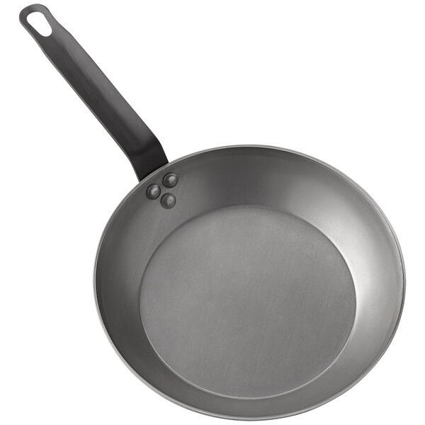 An American Metalcraft carbon steel fry pan with a handle.