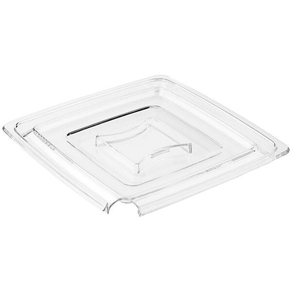 A clear square plastic lid with a spoon holder.