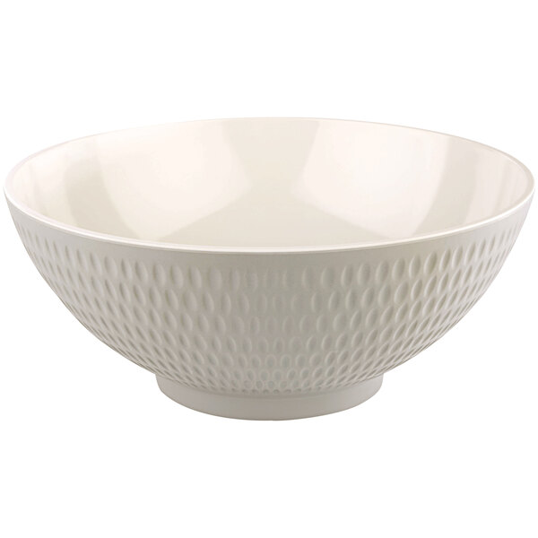 A cream melamine bowl with a textured circular pattern.