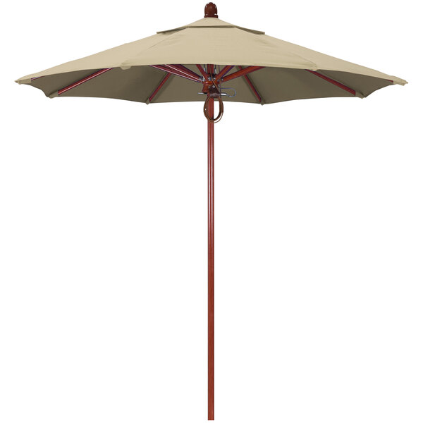 A tan umbrella with a red oak pole and antique beige canopy.