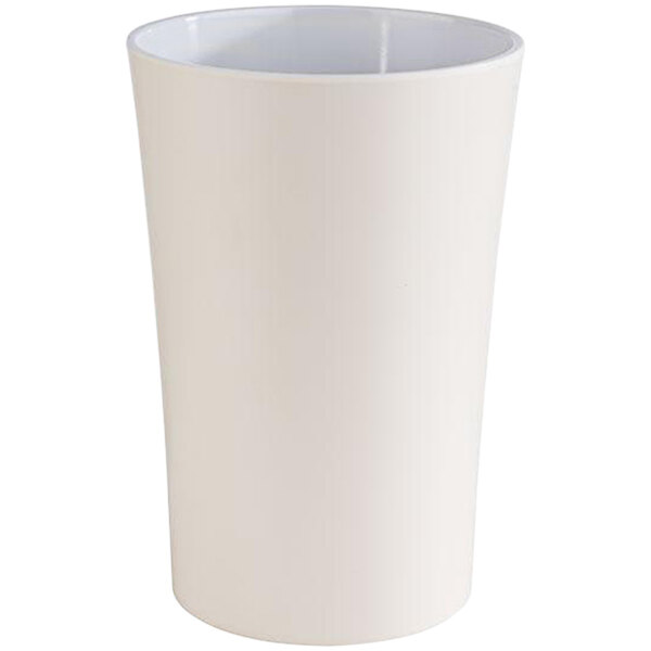 A white APS Pastell melamine dressing pot cup.