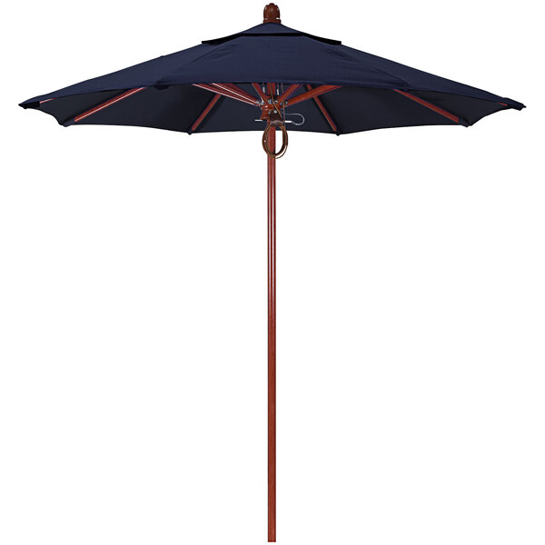 A blue California Umbrella with a navy canopy and red oak pole.