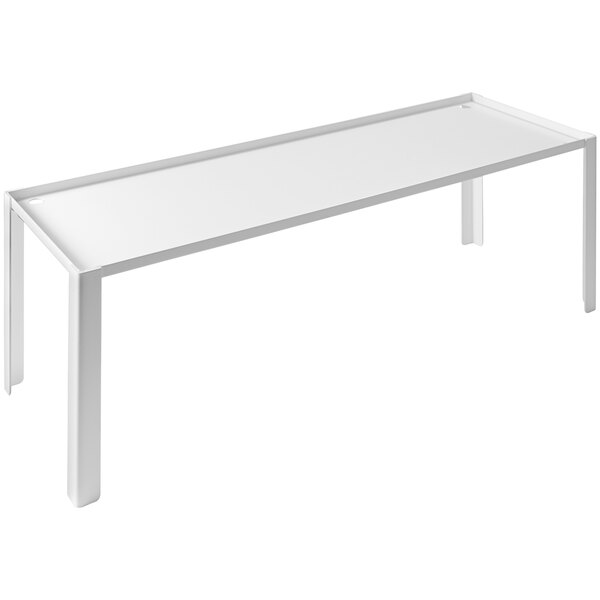 A white rectangular buffet podium with legs on a white table.